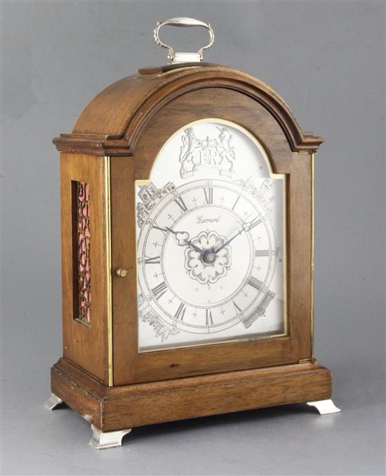 A silver mounted mahogany quarter chiming table clock, by J.W. Elliott Ltd for Garrard, 15in.